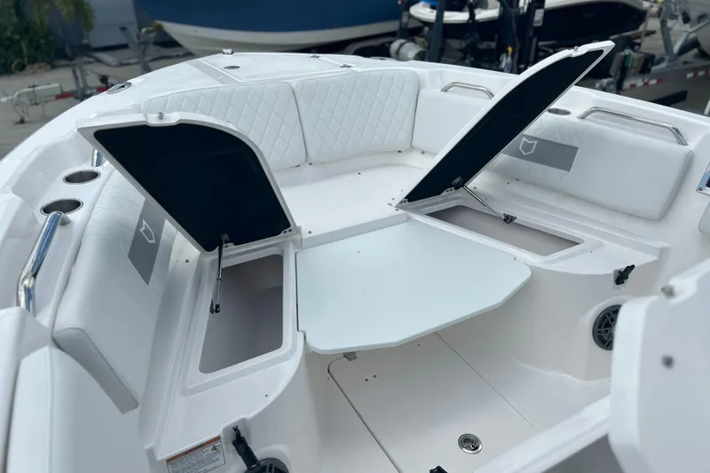 Slide: The Image of 2026 Sea Fox 268 Commander boat interior with open storage compartments and seating. - 23