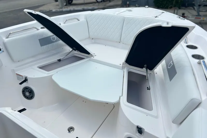 Slide: The Image of 2026 Sea Fox 268 Commander boat interior with open storage compartments and seating. - 24