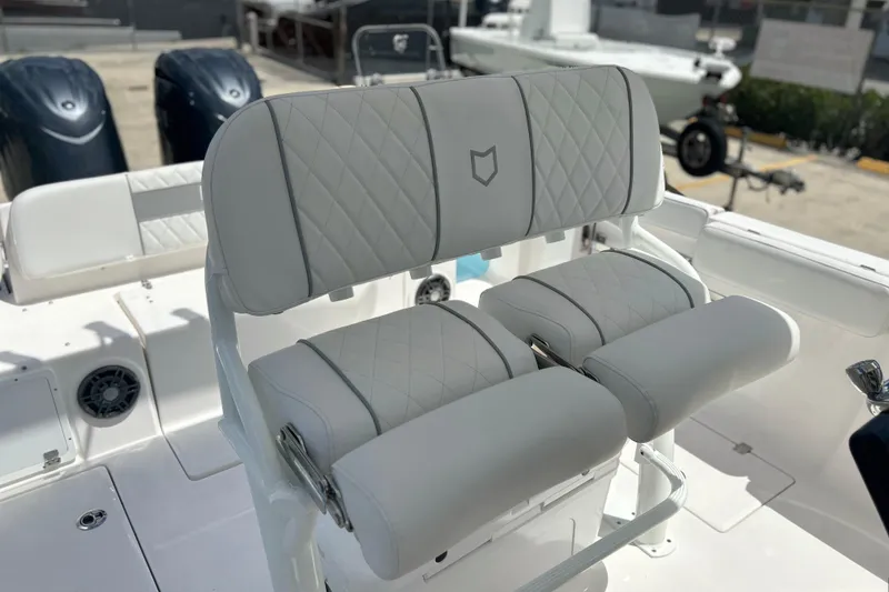 Slide: The Image of 2026 Sea Fox 268 Commander boat with luxurious white seating and dual engines. - 30