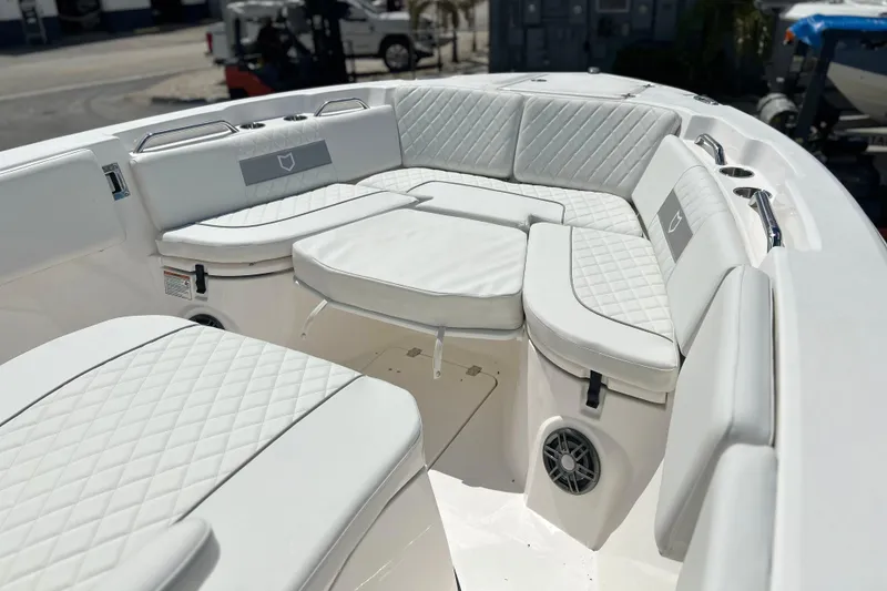 Slide: The Image of Luxurious seating on 2026 Sea Fox 268 Commander boat, featuring quilted white upholstery. - 4