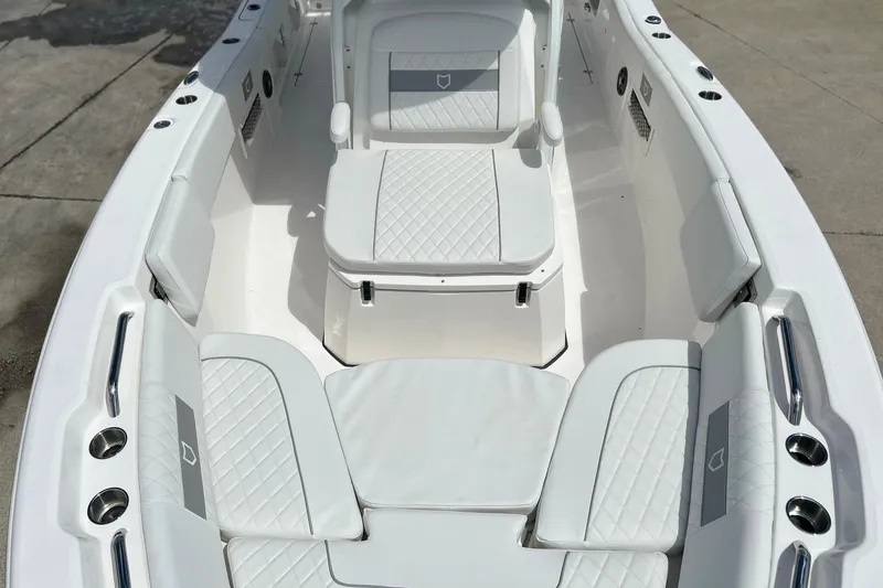 Slide: The Image of 2026 Sea Fox 268 Commander boat interior with white cushioned seating and sleek design. - 6