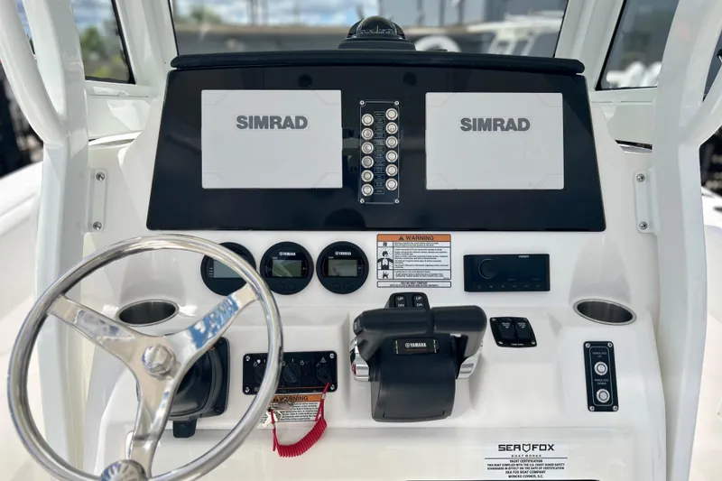 Slide: The Image of 2026 Sea Fox 268 Commander dashboard with Simrad displays and Yamaha controls. - 8