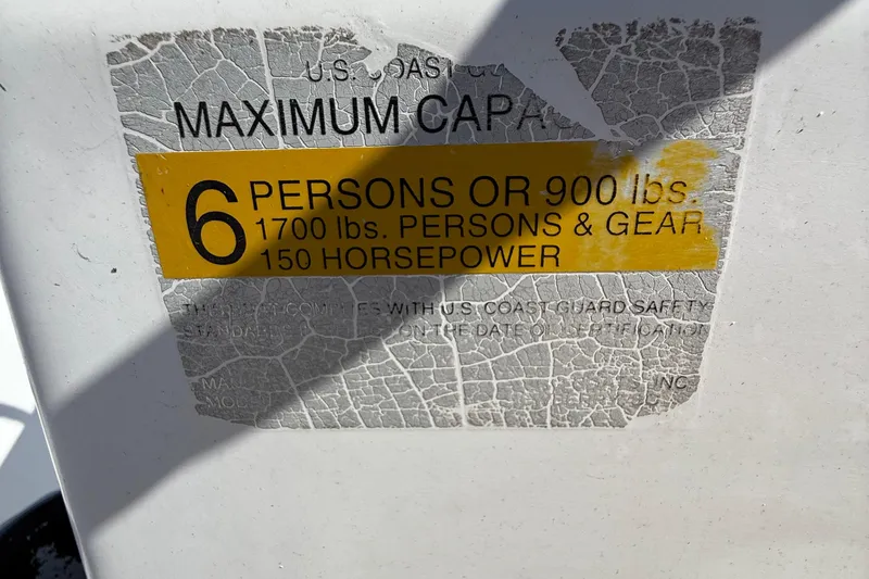Slide: The Image of 2004 Sea Pro 190 Center Console capacity label, 6 persons or 900 lbs, 150 horsepower. - 18