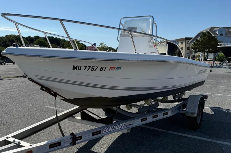 Slide: The Image of 2004 Sea Pro 190 Center Console boat on trailer in parking lot. - 4