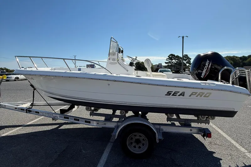 Slide: The Image of 2004 Sea Pro 190 Center Console boat on trailer, featuring Mercury outboard motor. - 5