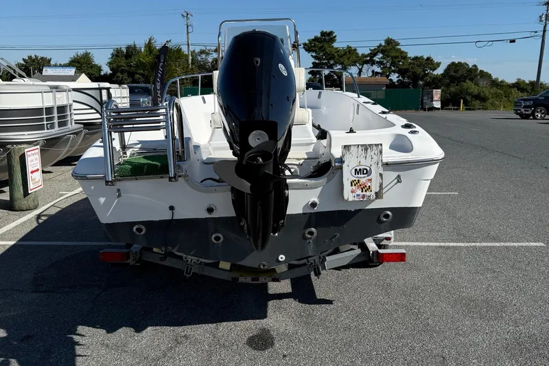 Slide: The Image of 2004 Sea Pro 190 Center Console boat on trailer, rear view in parking lot. - 7