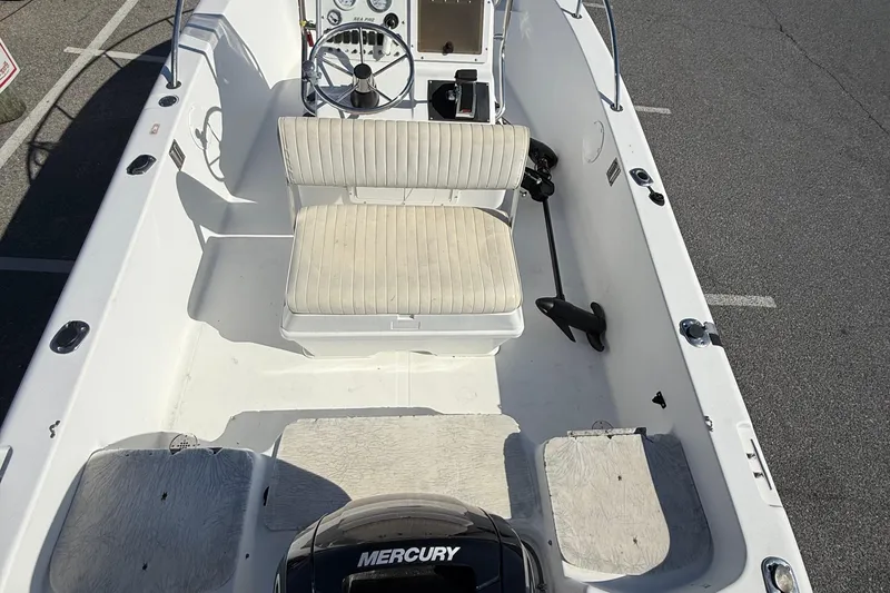 Slide: The Image of 2004 Sea Pro 190 Center Console boat interior with steering wheel and seating. - 9