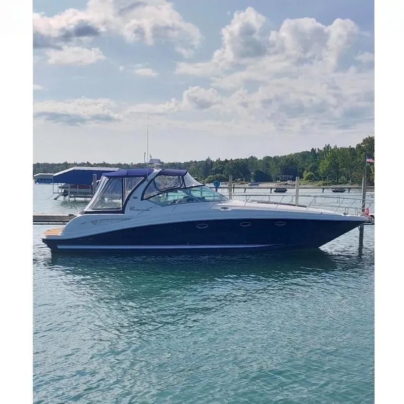 The Image of 2004 Sea Ray 420 Sundancer yacht docked on a sunny day. - 0