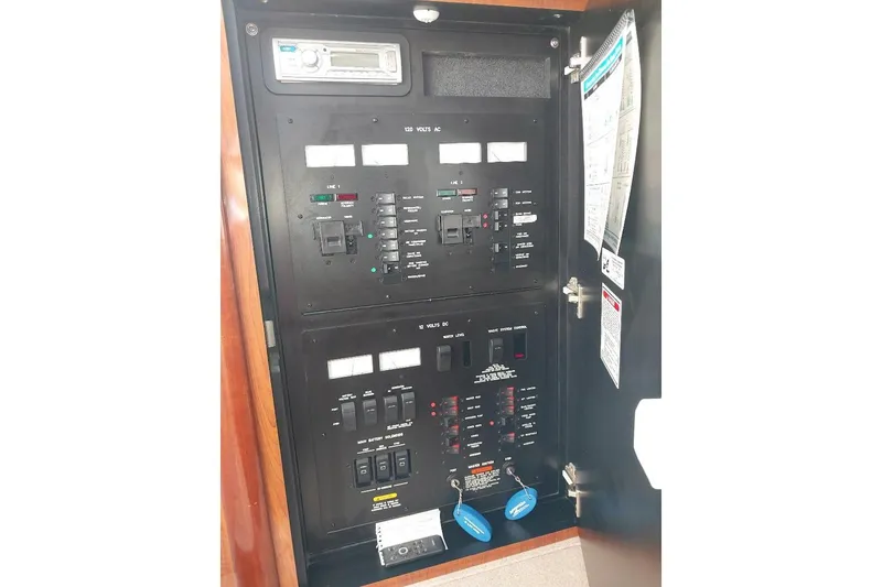 Slide: The Image of Electrical control panel on a 2004 Sea Ray 420 Sundancer yacht. - 23