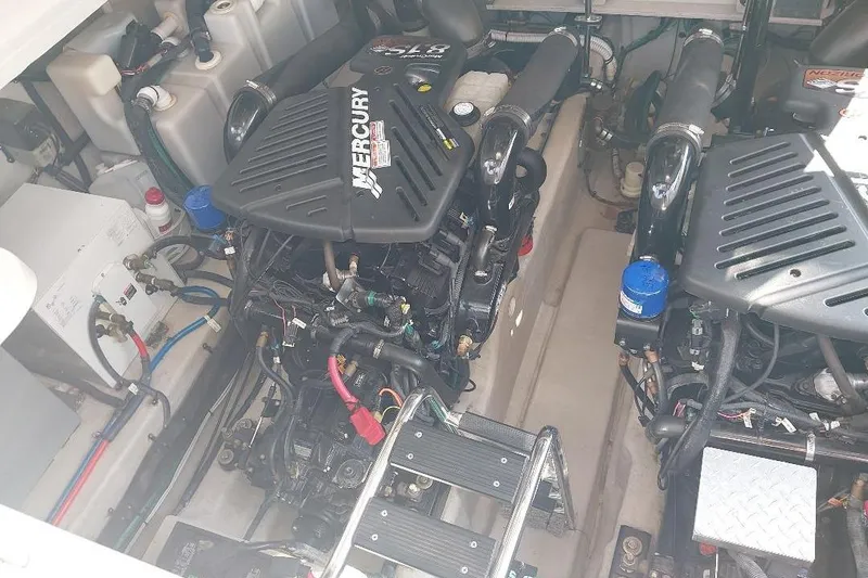 Slide: The Image of Engine compartment of a 2004 Sea Ray 420 Sundancer with Mercury engines. - 24