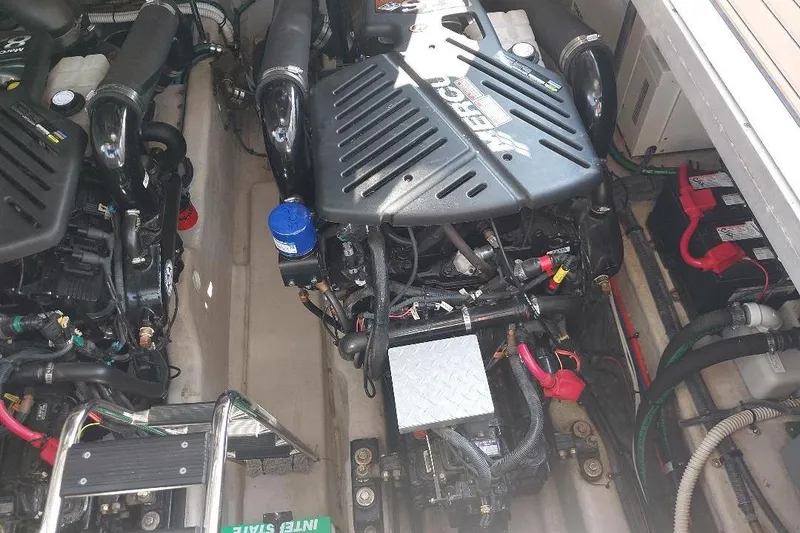 Slide: The Image of Engine compartment of a 2004 Sea Ray 420 Sundancer with visible MerCruiser engines. - 25