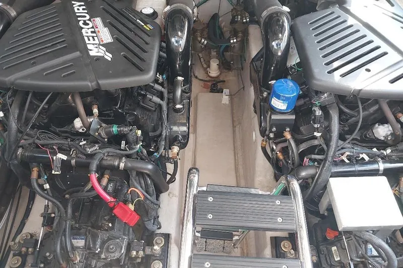 Slide: The Image of Engine compartment of a 2004 Sea Ray 420 Sundancer with dual Mercury engines. - 26