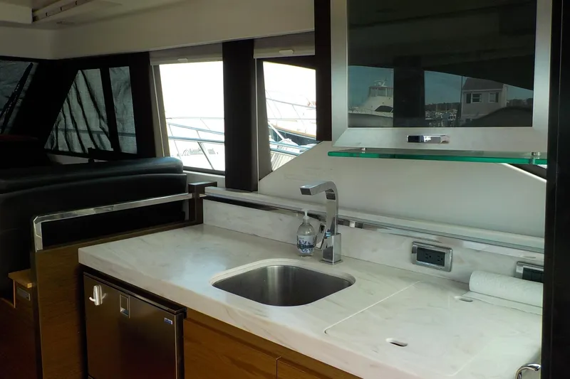 Slide: The Image of Luxurious interior of 2018 Tiara Yachts 39 Coupe with elegant seating and wooden table. - 11