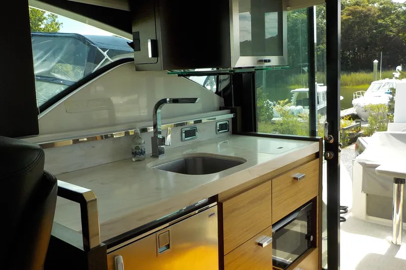 Slide: The Image of Interior of 2018 Tiara Yachts 39 Coupe with wooden flooring and modern furnishings. - 12