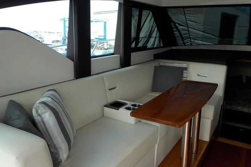 Slide: The Image of 2018 Tiara Yachts 39 Coupe under a partly cloudy sky. - 2