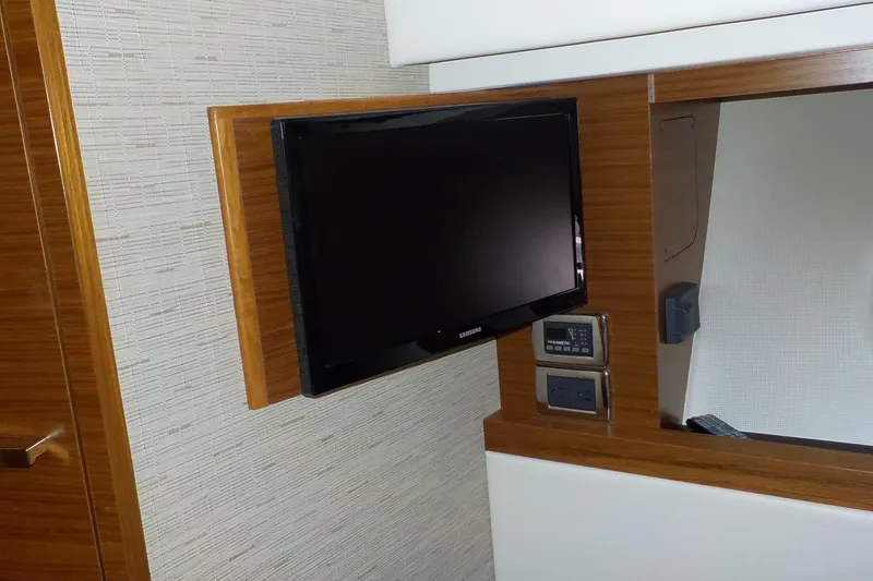 Slide: The Image of Luxurious bedroom interior of 2018 Tiara Yachts 39 Coupe with elegant bedding. - 23