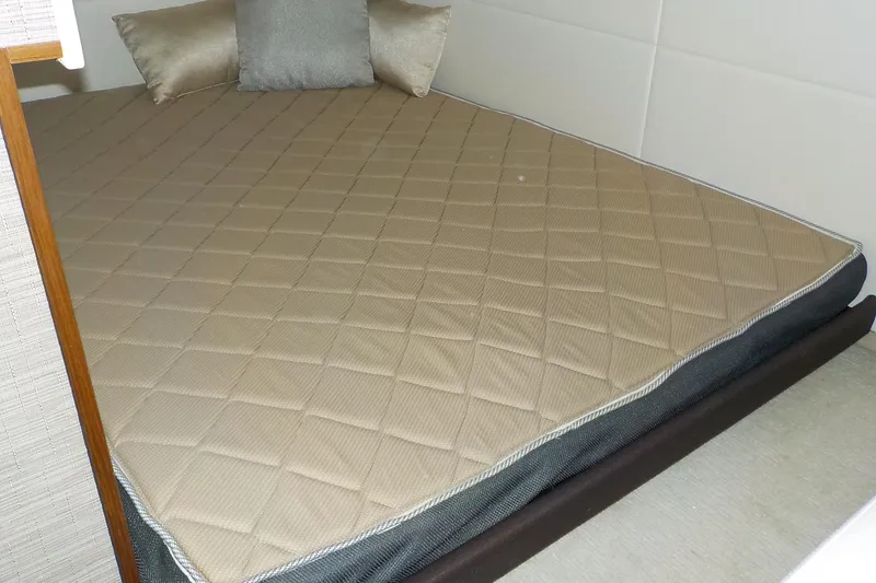 Slide: The Image of 2018 Tiara Yachts 39 Coupe interior with wall-mounted TV and control panel. - 26