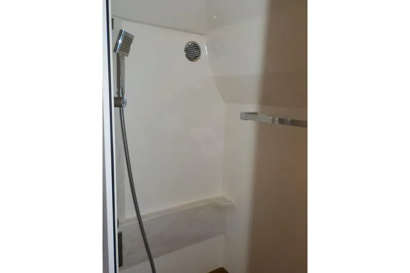 Slide: The Image of Luxurious bathroom interior of 2018 Tiara Yachts 39 Coupe with modern sink and porthole. - 31