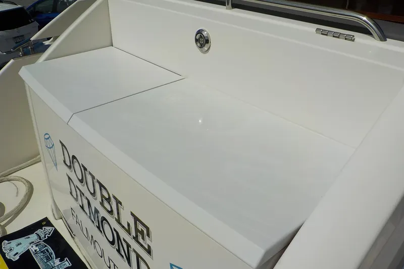 Slide: The Image of 2018 Tiara Yachts 39 Coupe cockpit with covered seating and table. - 45