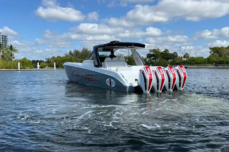 Slide: The Image of 2025 Cigarette 41 Nighthawk boat with quad engines on a sunny day. - 10