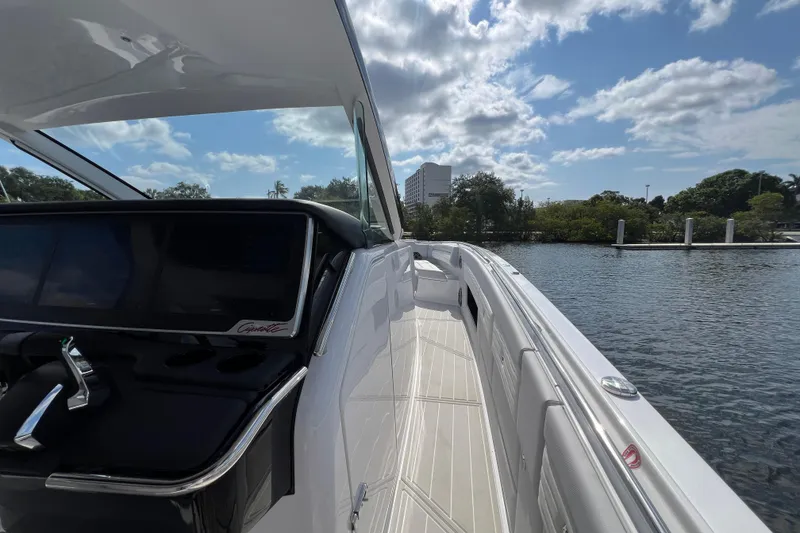 Slide: The Image of 2025 Cigarette 41 Nighthawk boat on water, featuring sleek design and modern controls. - 26