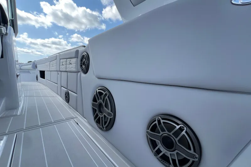 Slide: The Image of 2025 Cigarette 41 Nighthawk boat interior with speakers and sleek design. - 39