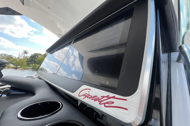 Slide: The Image of 2025 Cigarette 41 Nighthawk dashboard with touchscreen display and sleek design. - 44