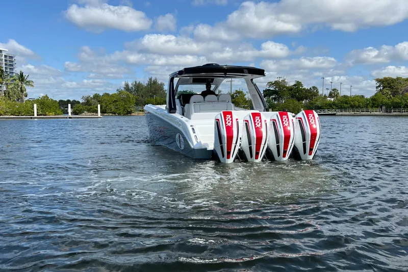 Slide: The Image of 2025 Cigarette 41 Nighthawk boat with four powerful engines on a sunny day. - 9