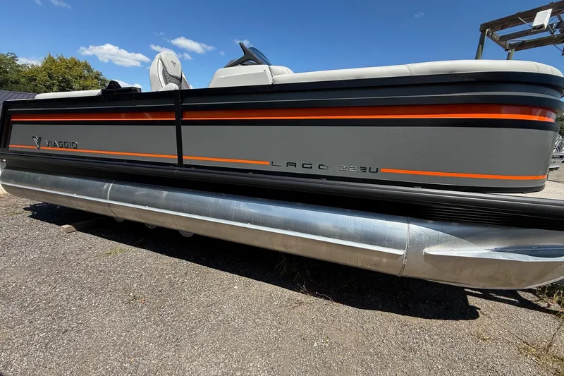 The Image of 2026 Viaggio Lago Z22U pontoon boat with sleek gray and orange design. - 0