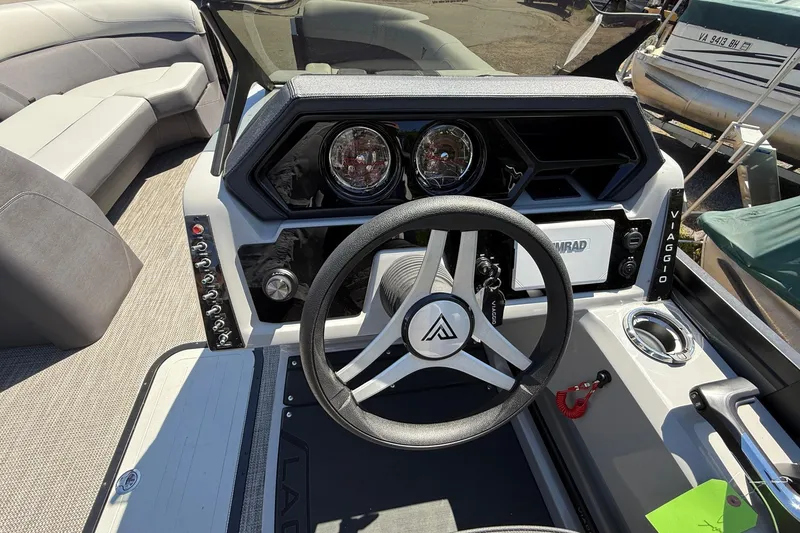 Slide: The Image of 2026 Viaggio Lago Z22U boat dashboard with steering wheel and control panel. - 14