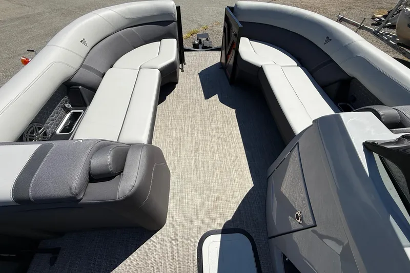 Slide: The Image of 2026 Viaggio Lago Z22U boat interior with gray seating and carpeted floor. - 15