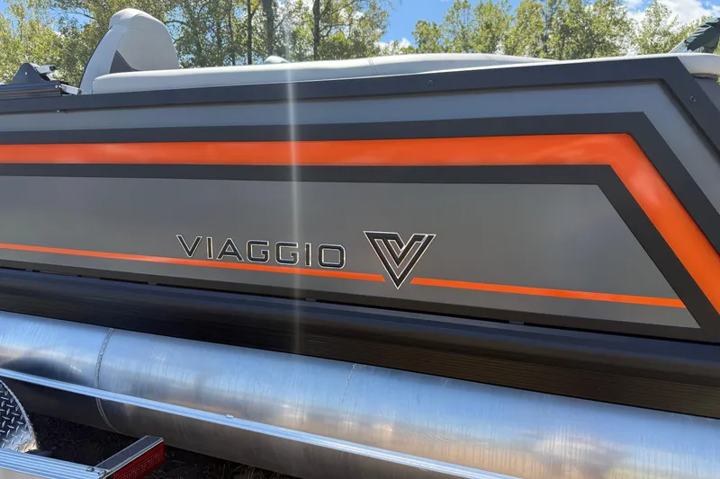 Slide: The Image of 2026 Viaggio Lago Z22U boat with sleek design and vibrant orange accents. - 2