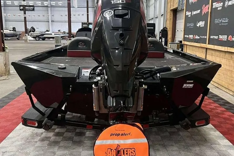 Slide: The Image of 2018 Ranger RT198P boat with 150 HP motor in showroom, featuring prop alert cover. - 3