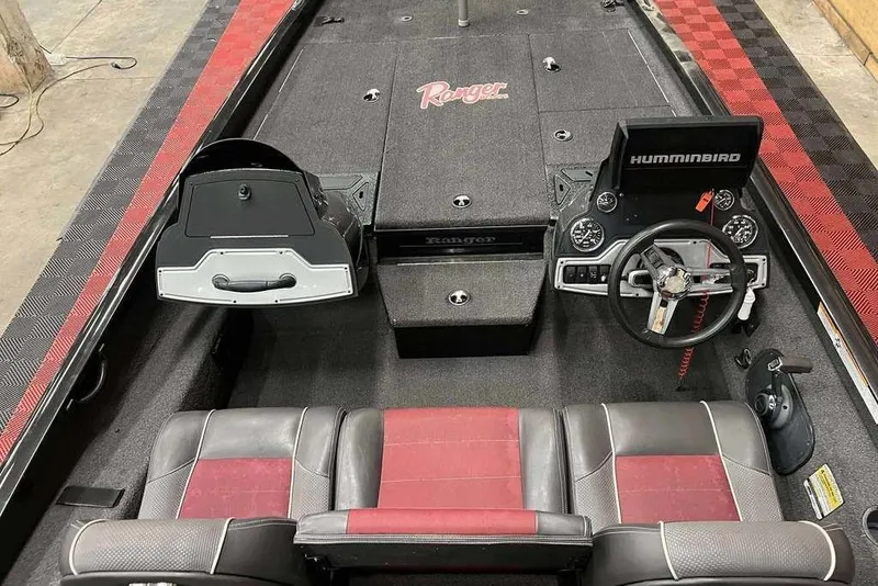 Slide: The Image of 2018 Ranger RT198P boat interior with steering wheel, seats, and Humminbird electronics. - 8