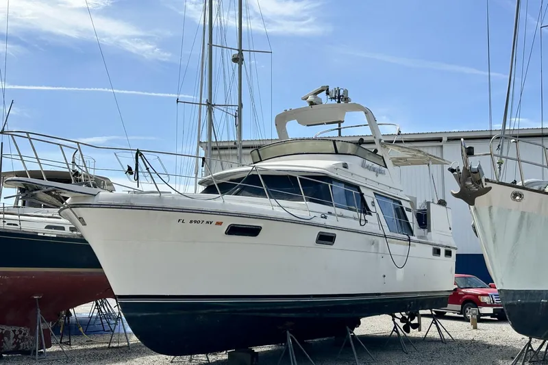 Slide: The Image of 1986 Carver 42 Aft Cabin Motoryacht on stands in a boatyard. - 2
