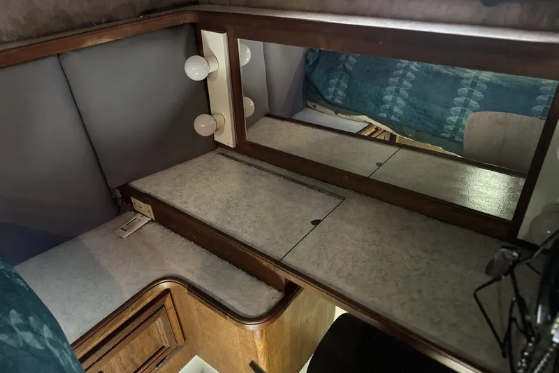 Slide: The Image of Vanity area in 1986 Carver 42 Aft Cabin Motoryacht with mirror and lighting. - 23