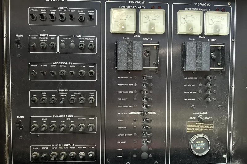 Slide: The Image of Control panel of a 1986 Carver 42 Aft Cabin Motoryacht with various switches and gauges. - 31