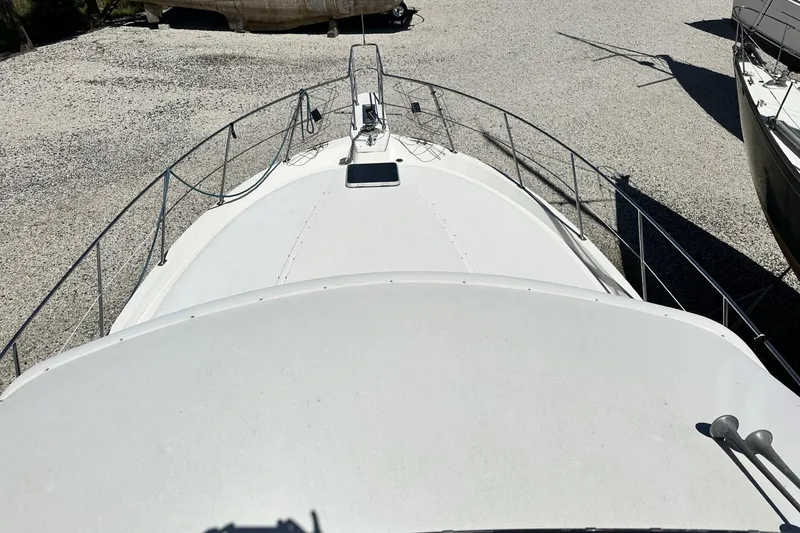 Slide: The Image of 1986 Carver 42 Aft Cabin Motoryacht on gravel, top deck view. - 33