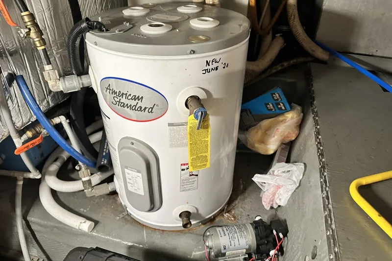Slide: The Image of American Standard water heater in 1986 Carver 42 Aft Cabin Motoryacht engine room. - 44