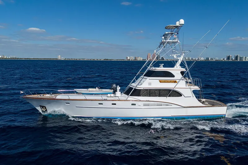 Slide: The Image of 1985 Feadship Yacht Fisherman cruising on open sea under clear blue sky. - 10