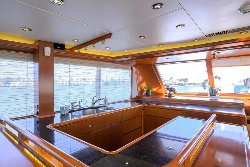 Slide: The Image of Luxurious 1985 Feadship Yacht Fisherman kitchen with sleek wood and modern fixtures. - 103