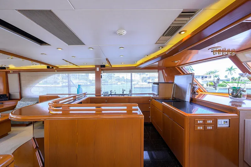 Slide: The Image of Luxurious 1985 Feadship Yacht Fisherman interior with modern kitchen and elegant wood finishes. - 106