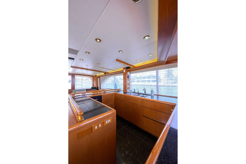 Slide: The Image of Luxurious 1985 Feadship Yacht Fisherman interior with sleek wood cabinetry and modern fixtures. - 120
