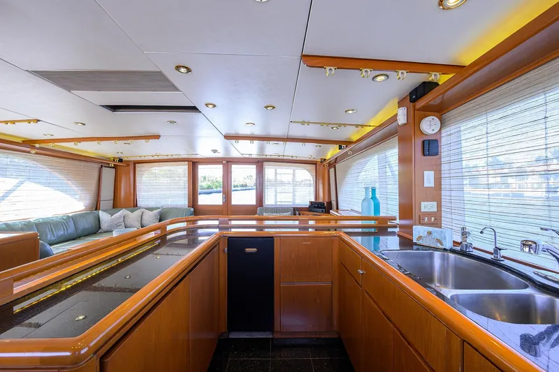 Slide: The Image of Luxurious interior of a 1985 Feadship Yacht Fisherman with modern kitchen and seating area. - 122