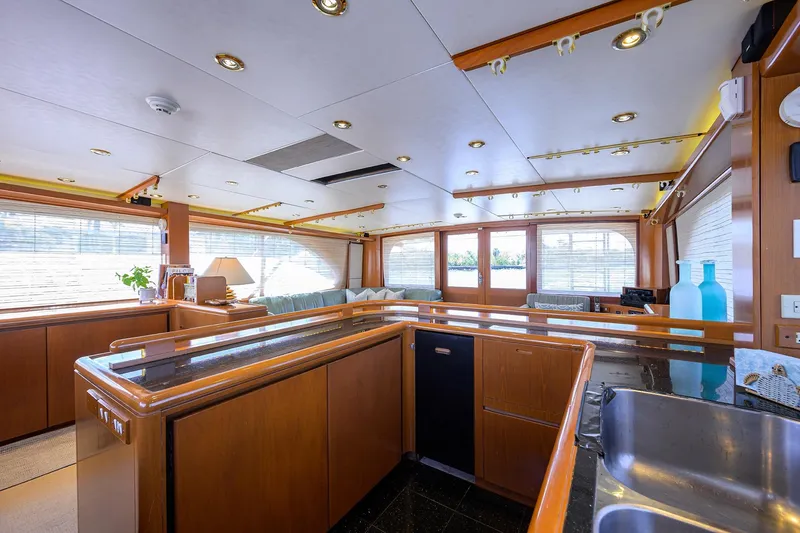 Slide: The Image of Luxurious interior of 1985 Feadship Yacht Fisherman with modern kitchen and elegant decor. - 123