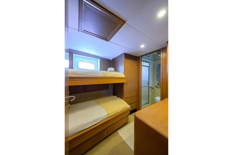 Slide: The Image of 1985 Feadship Yacht Fisherman cabin with bunk beds and ensuite bathroom. - 125