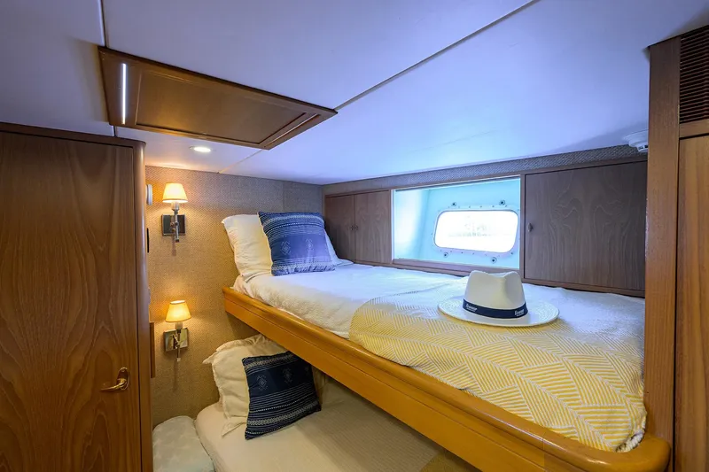 Slide: The Image of Cozy cabin interior of 1985 Feadship Yacht Fisherman with bunk beds and nautical decor. - 128