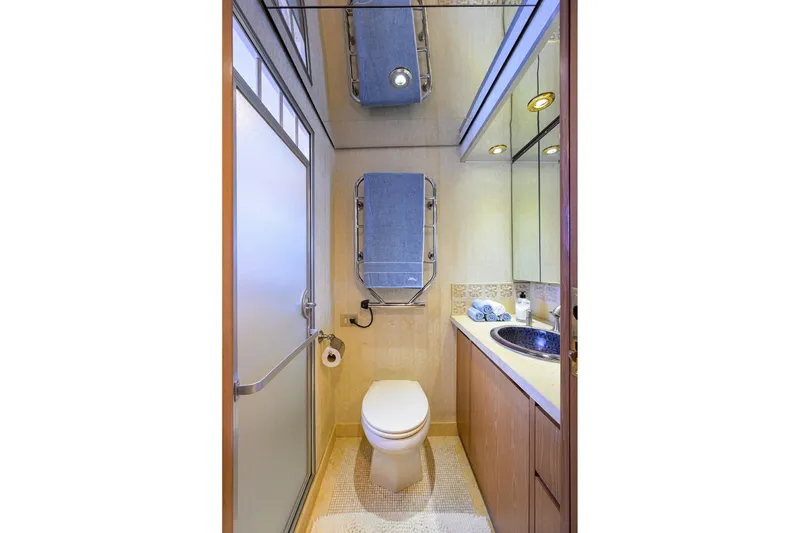 Slide: The Image of Luxurious bathroom on 1985 Feadship Yacht Fisherman with modern fixtures and elegant design. - 130