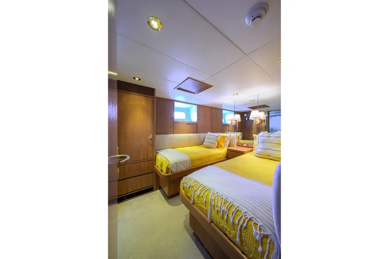 Slide: The Image of Luxurious 1985 Feadship Yacht Fisherman cabin with twin beds and elegant wood paneling. - 134
