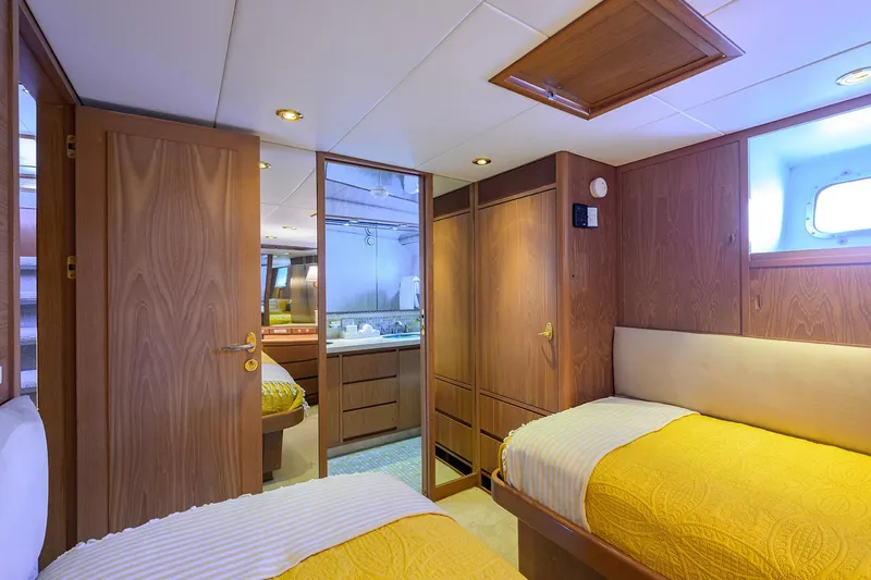 Slide: The Image of Luxurious 1985 Feadship Yacht Fisherman cabin with twin beds and wooden interior. - 136